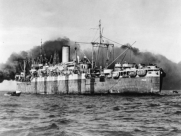 USS Joseph T. Dickman (APA-13) in the process of disembarking troops, c. 1943