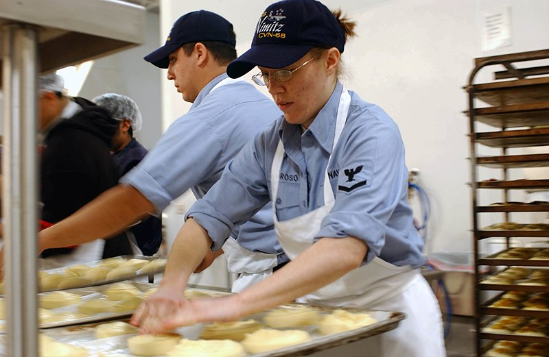 File:US Navy 040226-N-8273J-169 Working with a local bakery, Culinary Specialist 3rd Class Nickie Amoroso, of Delta, Colo., prepares pastries.jpg