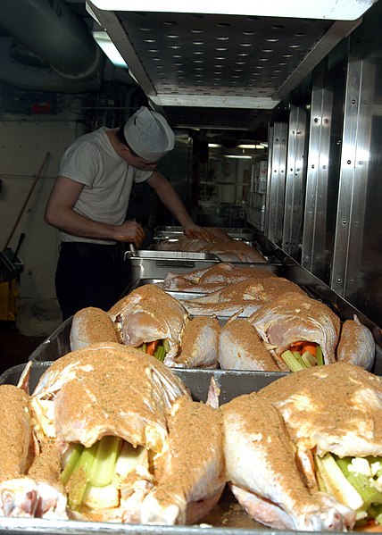 File:US Navy 041124-N-1205W-002 A Culinary Specialist seasons one of 175 turkeys that will be served to the crew on Thanksgiving Day aboard the conventionally powered aircraft carrier USS John F. Kennedy (CV 67).jpg