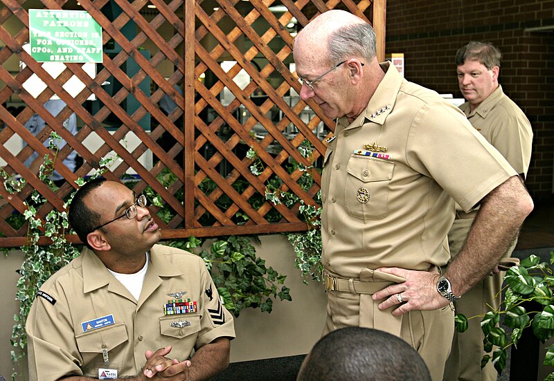 File:US Navy 050511-N-4204E-004 Chief of Naval Operations (CNO), Adm. Vern Clark, talk to Naval Air Technical Training Center (NATTC) instructor Aviation Electrician's Mate 1st Class Michael Santos.jpg