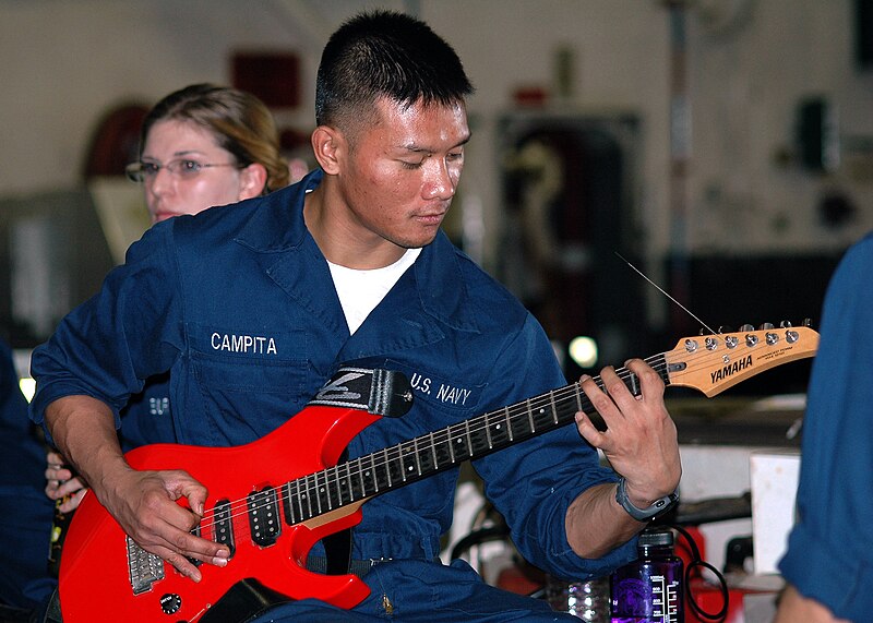 File:US Navy 051211-N-7217H-025 Airman Paul Campita plays his guitar during a "Steel Beach Picnic" aboard the amphibious assault USS Tarawa (LHA 1).jpg