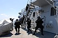 Members of the Brunei Special Forces rush towards the pilot house of USS Howard (DDG 83) during a visit, board, search and seizure exercise on Aug 18, 2008.