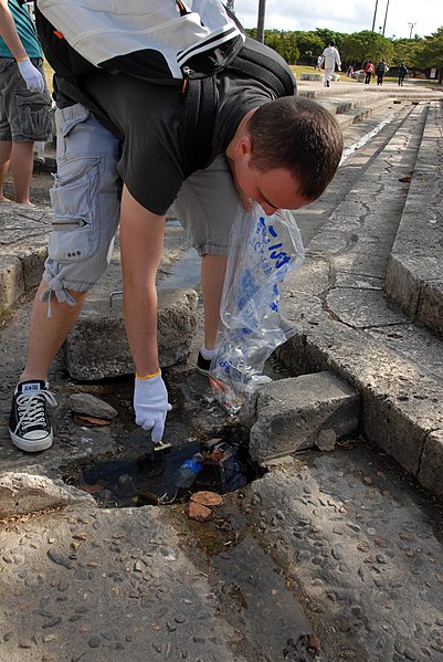 File:US Navy 090129-N-8490W-005 Intelligence Specialist Kurt Henrickson picks up trash during a park clean-up community relations project at an Okinawan complex park.jpg