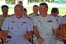 Royal Thai Navy Rear Adm. Chaiyot Sundaranaga, left, commander of Frigate Squadron 2, and Capt. David Welch, commander of Task Group 73.1, share a laugh before the dedication for a Cooperation Afloat Readiness and Training (CARAT) Thailand 2011 engineering project. US Navy 110519-N-VP123-240 Royal Thai Navy Rear Adm. Chaiyot Sundaranaga, left, and Capt. David Welch share a laugh before the dedication for a CAR.jpg