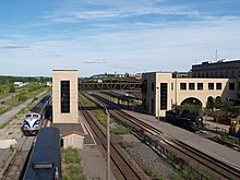 The rear of Union Station with an Adirondack Railroad train approaching Utica Railroad Station.jpg