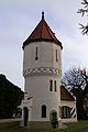 Nähe Hauptstraße; ehemaliges Wasserwerk Harthausen, Wasserbehälter in Form eines mittelalterlichen Wehrturms mit Rundbogenfries und angefügtem kleinem Wasserhaus mit Treppengiebel, bezeichnet mit „1901“. This is a picture of the Bavarian Baudenkmal (cultural heritage monument) with the ID D-1-84-121-5 (Wikidata)