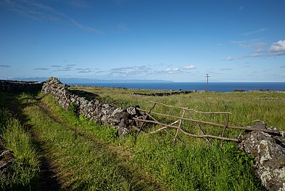 Wooden fence along dirt path, Caldeira, Graciosa Island, Azores, Portugal