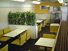 Interior of former buffet car 37-7302 in set R62 used as a general lounge area in May 2002