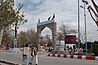 Residents of Ghazni City walk past newly constructed gates and monuments in Ghazni