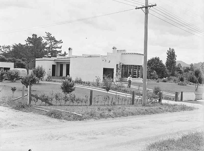 File:A man and woman standing outside a house (AM 75523-1).jpg