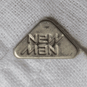 Ambigram New Man logo metal button on a shirt animated gif.gif