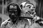 Asaro mudman holding mask, Papua New Guinea