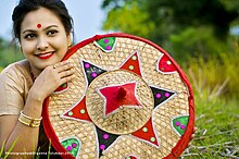 A bihu dancer with Japi (Assamese headgear) Bihu3.jpg