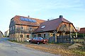 Residential house with right-angled extension (in this former forge) and barn