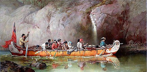 Canoe manned by voyageurs passing a waterfall