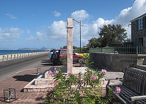 A view of the Christena Memorial on the Charlestown waterfront on Nevis, looking north towards St. Kitts. Nags head visible in the distance on the left. Part of the Alexander Hamilton house is visible on the right, 2014. Christena memoral view.JPG