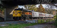 A Cuyahoga Valley Scenic Railroad train, led by FPA-4 diesel locomotive No. 6771, idles at Rockside Road in Independence, Ohio, on November 4, 2017 Cuyahoga Valley Scenic Railroad at Rockside Road.jpg