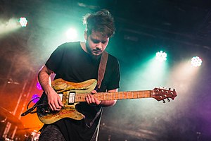 David on stage during his European Tour alongside Plini and Disperse.