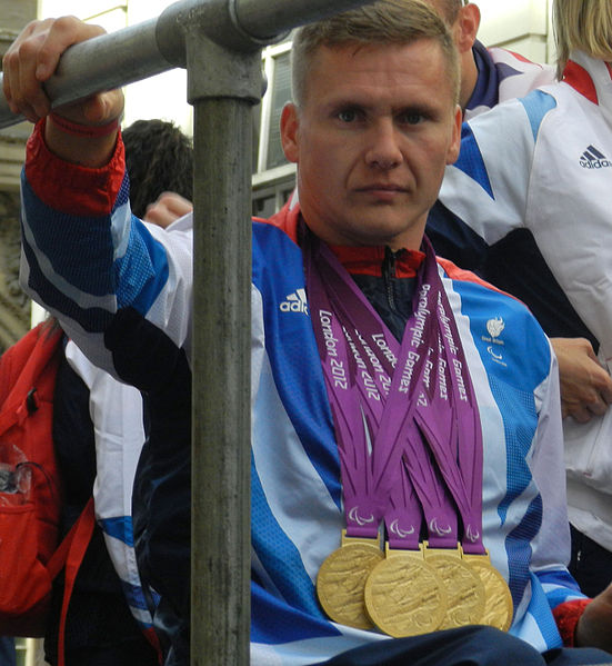 Weir at the Olympics Victory Parade wearing the four gold medals he won during the 2012 Summer Paralympics