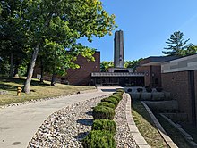 The building that originally housed the Des Moines Center of Science and Industry, when it was located within Greenwood-Ashworth Park. The narrow tower housed the wire supporting the Foucault pendulum. DesMoinesCenterOfScienceAndIndrustry.jpg