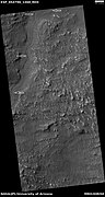 Channel, as seen by HiRISE under HiWish program Arrows indicate position of channel in this rather dark photo.