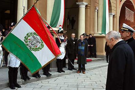 The former President of the Italian Republic Carlo Azeglio Ciampi honors the flag of Cispadane Republic, first Italian flag, during the Tricolour Day 