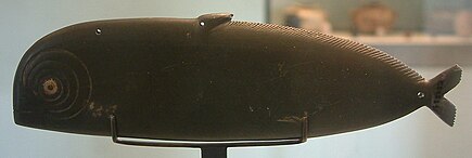 A fish palette- (dolphin type). Fish-shaped kohol palette-E 22731-Egypte louvre 311.jpg