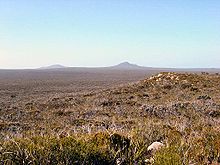 Fitzgerald River National Park, showing scrub-heath on a plain, with granite outcrop on the middle-ground right