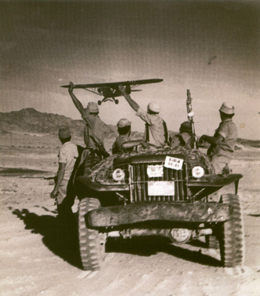 Israeli soldiers waving at a French Bomber 