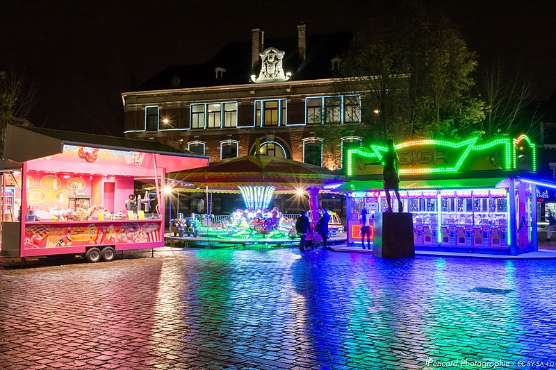 File:Funfair Lights On Wet Cobblestones (132570555).jpeg