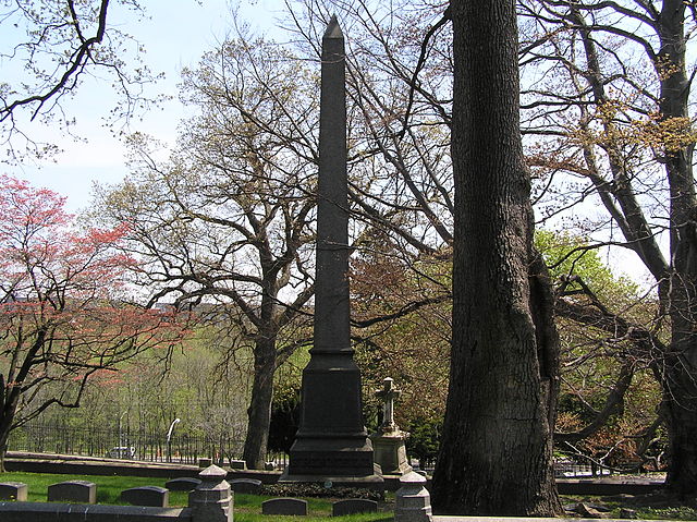 The tower of George Bird Grinnell's headstone in Woodlawn Cemetery
