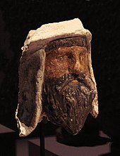 Painted clay and alabaster head of a Zoroastrian priest wearing a distinctive Bactrian-style headdress, Takhti-Sangin, Tajikistan, Greco-Bactrian kingdom, 3rd-2nd century BC Head of Bactrian ruler (Satrap), Temple of the Oxus, Takht-i-Sangin, 3rd-2nd century BC.jpg