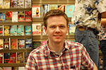 Thumbnail for File:Isaac Stewart, map illustrator, at book signing for Brandon Sanderson August 2007.jpg