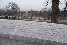 The most famous passage from the inaugural address is etched in stone at Kennedy's gravesite in Arlington National Cemetery, with the Lincoln Memorial and Washington Monument in the background. JFKInauguralInscriptionGravesite.jpg