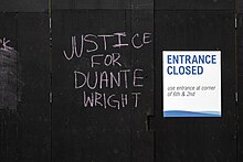 Graffiti on a boarded-up building in Minneapolis, April 16, 2021 Justice For Duante Wright graffiti on a boarded up business in downtown Minneapolis, Minnesota (51126201889).jpg