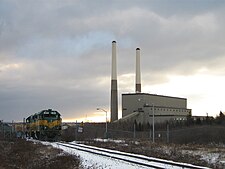 Two Sydney Coal Railway GP38-2 locomotives leave the Lingan Generating Station after unloading coal in Nova Scotia. Lingan Generating Station.jpg