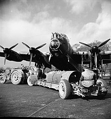 An 8,000-lb HC bomb ('super cookie') being loaded into a Lancaster of No. 106 Squadron at RAF Syerston, for an attack on Stuttgart