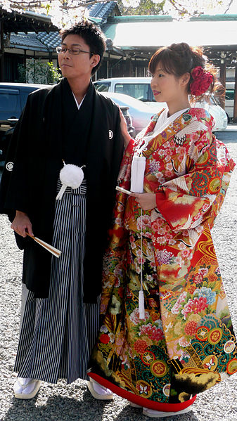 Photograph of a man and woman wearing traditional clothing, taken in Osaka, Japan