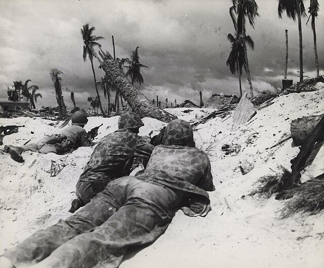 U.S. Marines advance on Japanese pill boxes, Tarawa, November 1943.