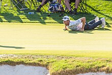 PGA Tour Professional Golfer Martin Trainer uses the seal-style plank to read a green Martin Trainer Seal-Style Plank.jpg