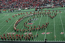 The UC Bearcat Band forms a C-Paw during their pre-game show. OnfieldCPaw.jpeg
