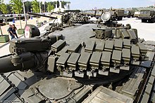 Kontakt-1 ERA on the frontal turret of T-62MV. Note the laser rangefinder box above the main gun