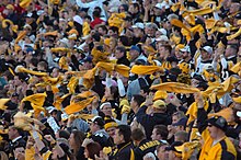 Pittsburgh Steelers' fans waving the Terrible Towel, a tradition that dates back to 1975 Pittsburgh Steeler fans 15 Oct 2006.jpg