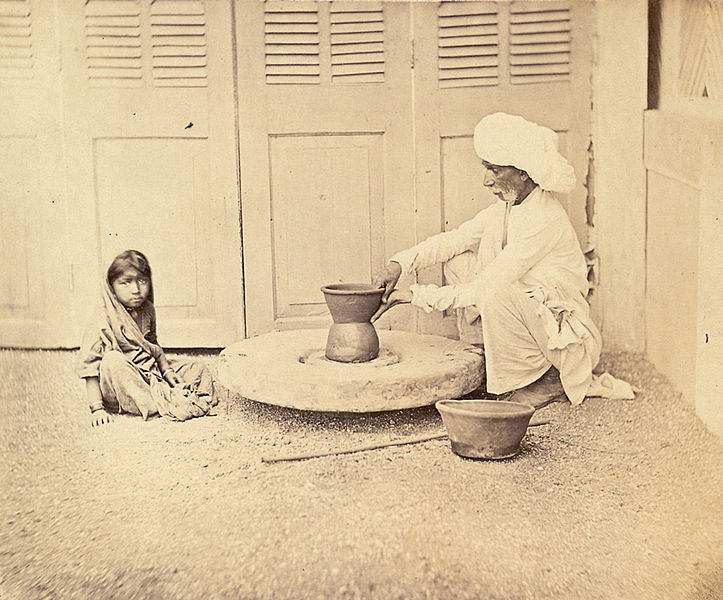 File:Potter at work at his wheel and a young girl is watching in Pune, Maharashtra - 1873.jpg