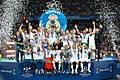 Ronaldo (second from the right) raising his hand in the air as Real Madrid celebrate winning the UEFA Champions League, on 26 May 2018