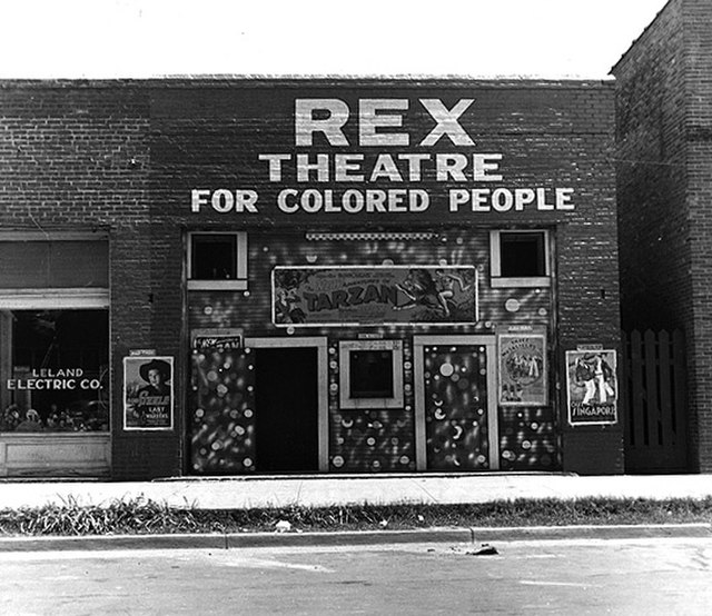 Rex Theatre for Colored People in Leland, 1937, by Dorothea Lange