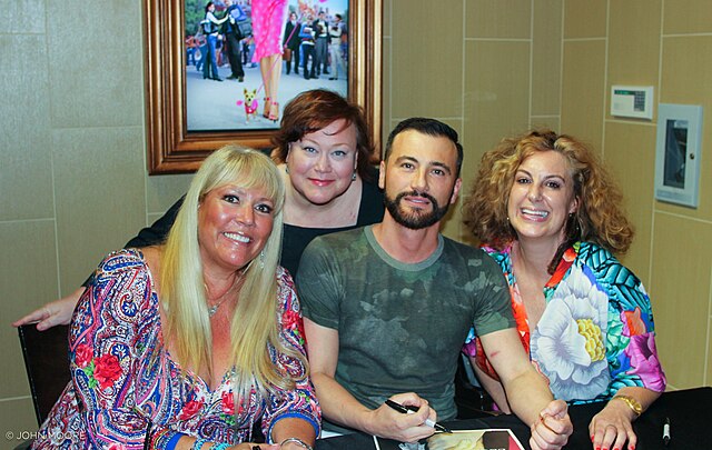 Karen McCullah Lutz, Robert Luketic and Kirsten Smith pose with a fan at a screening of Legally Blonde in 2016.