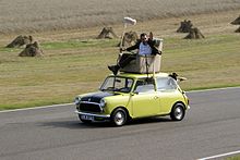 Rowan Atkinson re-enacting a famous scene from the episode "Do-It-Yourself Mr. Bean" on a Mini at Goodwood Circuit Revival 2009 Rowan Atkinson on a Mini at Goodwood Circuit in 2009.jpg