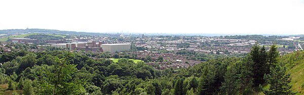 View of Shaw and Crompton from above Pingot Quarry by Crompton Moor. Shaw is in the foreground with Oldham over the hill to the left, Royton is centre-right with Manchester in the distance.