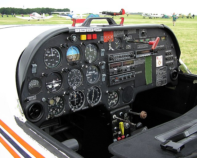 The cockpit of a Slingsby T-67 Firefly two-seat light airplane. The flight instruments are visible on the left of the instrument panel